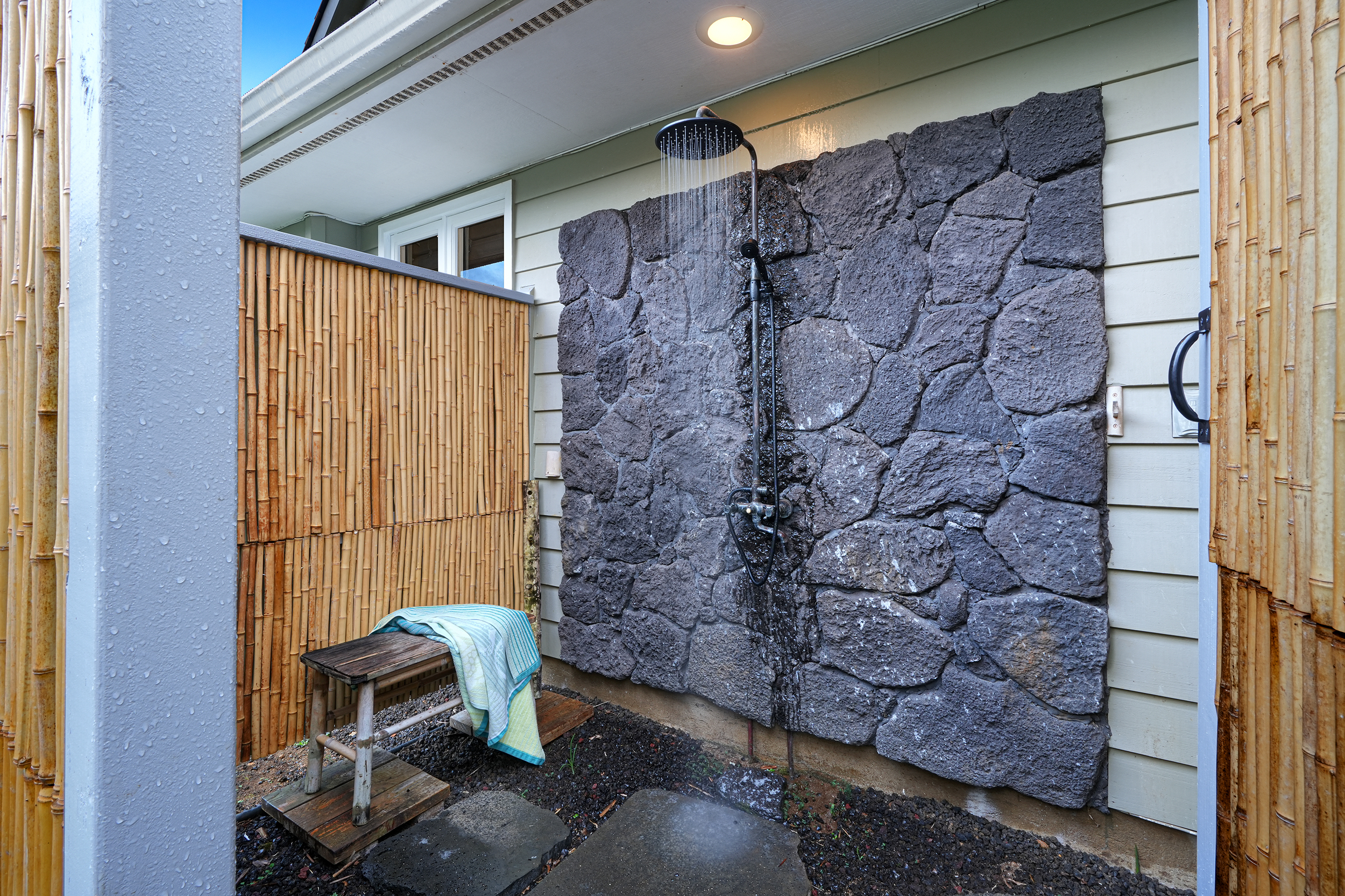 5348 Honoiki Road Princeville, HI 96722 - Photo 22 of 25 a bathroom with a toilet and shower curtain