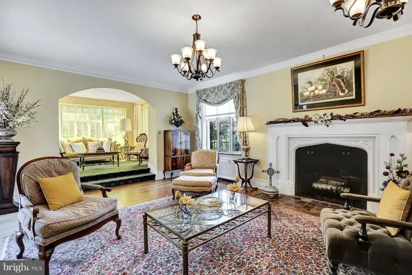 a bedroom with a bed chair and a window