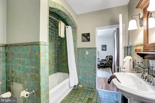 a bathroom with a toilet a sink and a shower