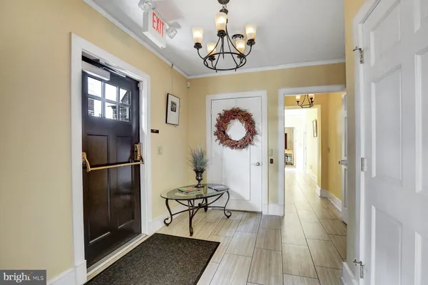 a kitchen with stainless steel appliances granite countertop a sink refrigerator and cabinets