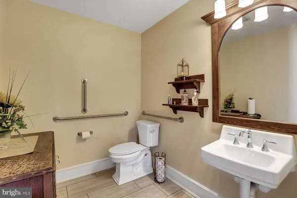 a large kitchen with stainless steel appliances granite countertop a stove granite counter tops and wooden cabinets