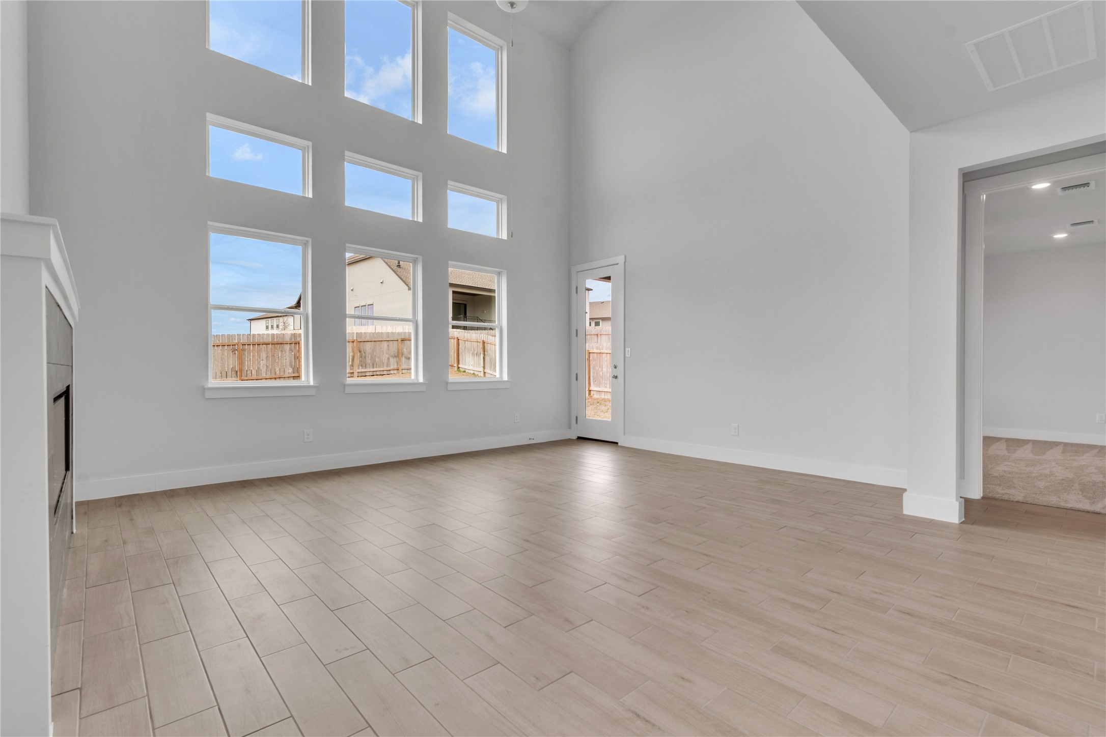 8500 Red Bottle Brush Road Lago Vista, TX 78645 - Photo 4 of 33 An airy living space features soaring high ceilings and an abundance of natural light.