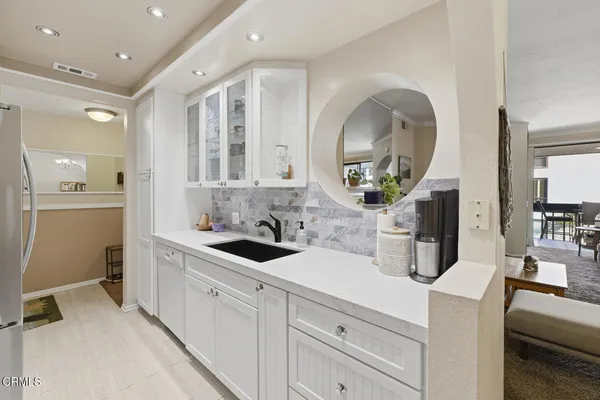 a kitchen that has a stove and a table