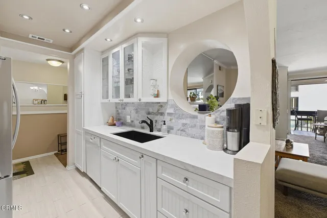 a kitchen that has a stove and a table