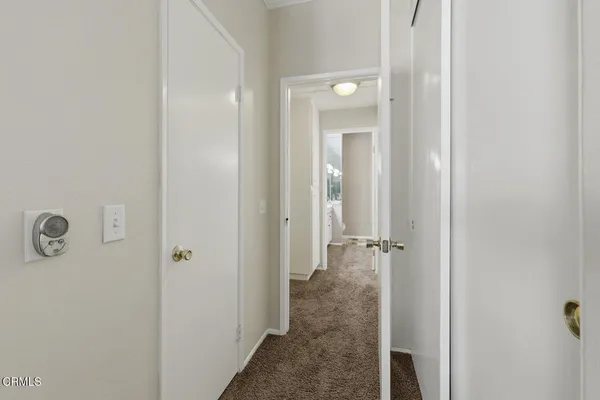 a bathroom with a double vanity sink and mirror with bathtub