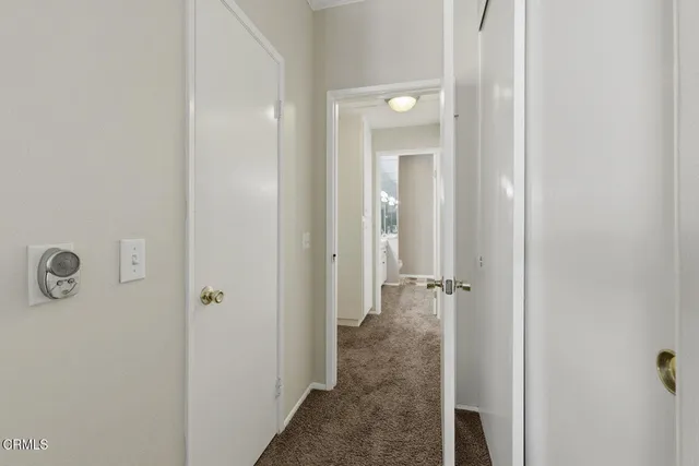 a bathroom with a double vanity sink and mirror with bathtub