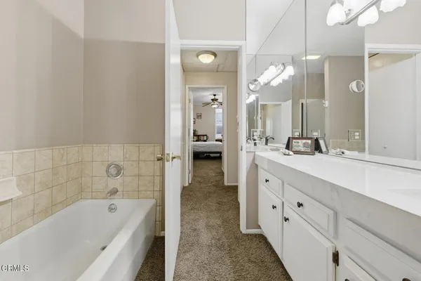 a view of a hallway with bathroom