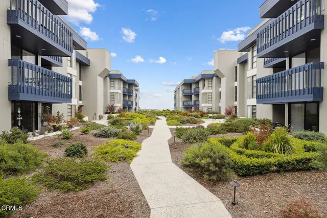 a view of a city and mountains in the background