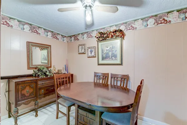 a dining room with furniture and window