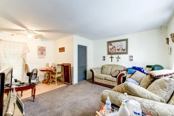 a living room with furniture and a large window