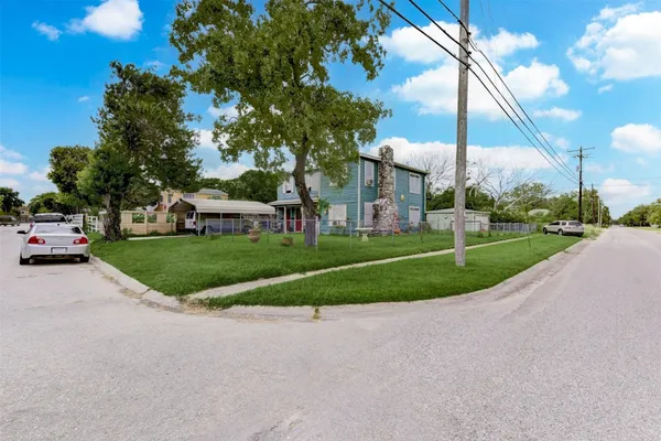 a view of a parked cars in front of a building