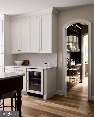 a kitchen with a stove and a refrigerator