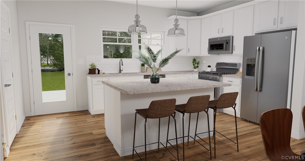 12220 Lightning Bug Loop Midlothian, VA 23112 - Photo 8 of 34 a view of kitchen with sink refrigerator dining table and chair