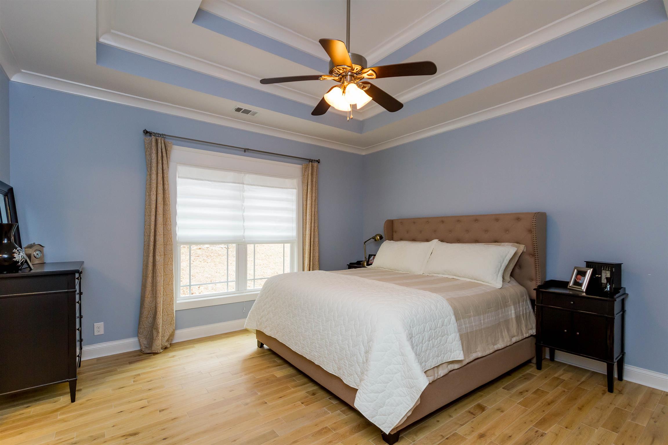 5488 Roy Pitt Road Springfield, TN 37172 - Photo 14 of 27 a bedroom with a bed and a chandelier