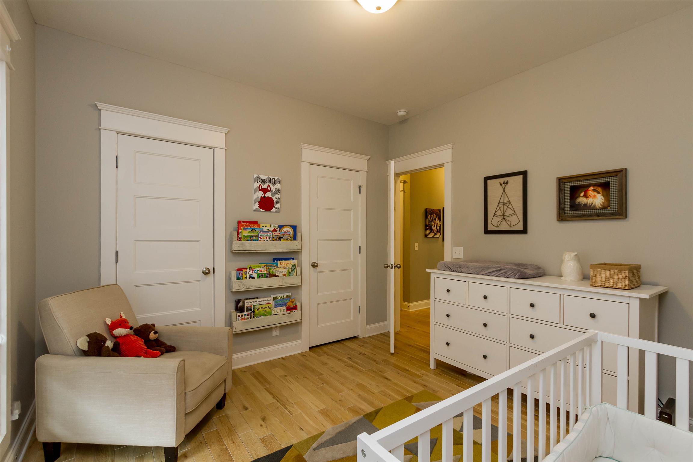 5488 Roy Pitt Road Springfield, TN 37172 - Photo 17 of 27 a bedroom with furniture and a wooden floor