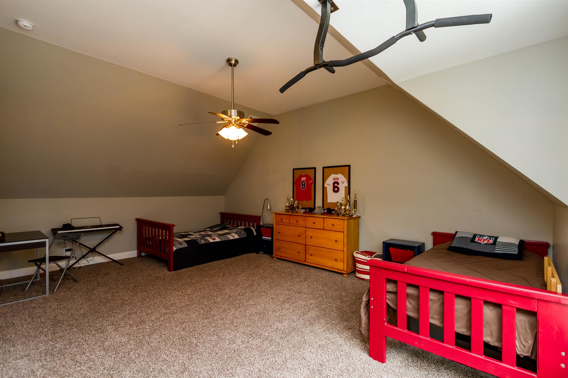 5488 Roy Pitt Road Springfield, TN 37172 - Photo 20 of 27 a bedroom with furniture and a chandelier