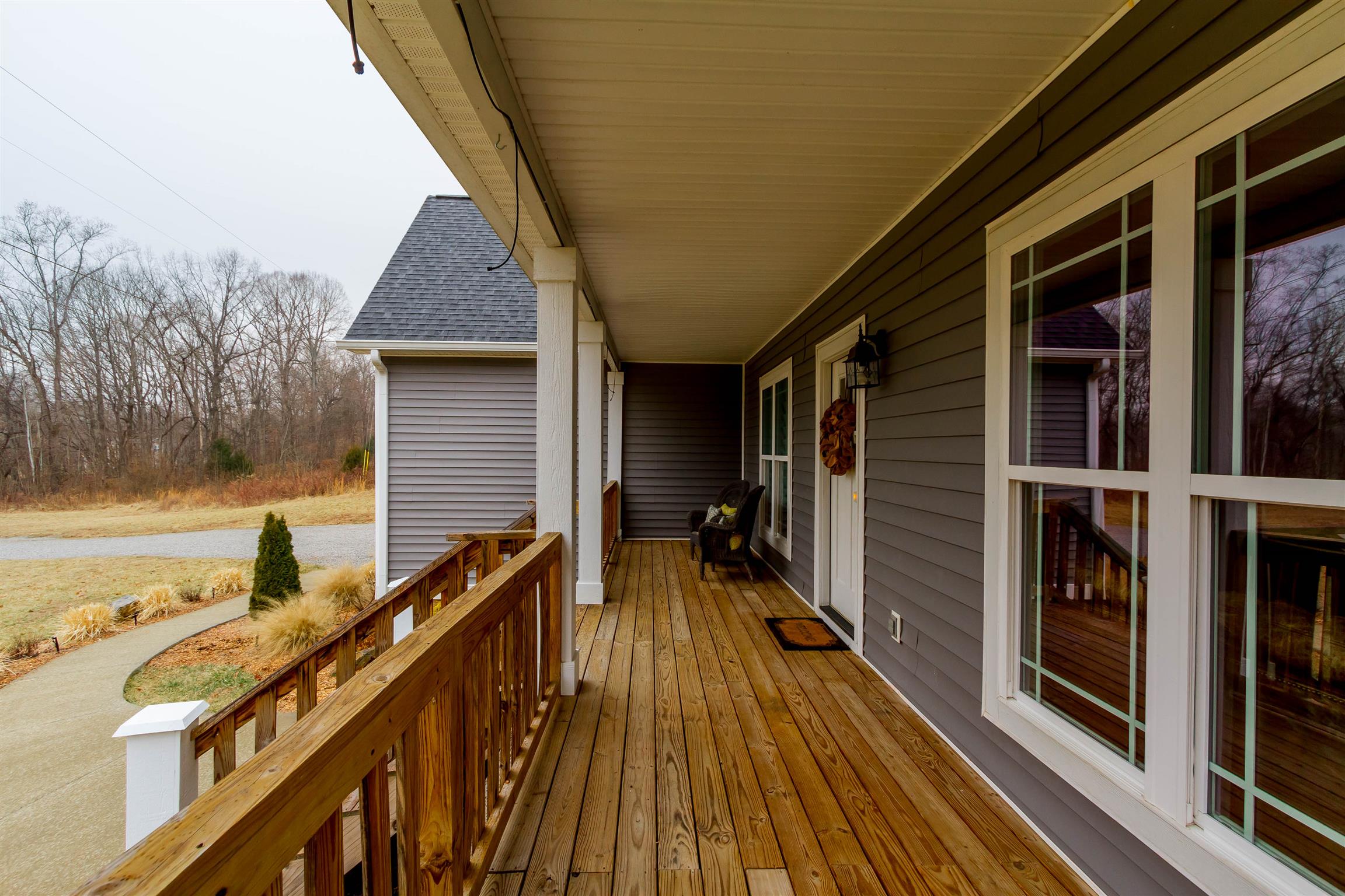 5488 Roy Pitt Road Springfield, TN 37172 - Photo 3 of 27 a view of balcony with wooden floor and fence