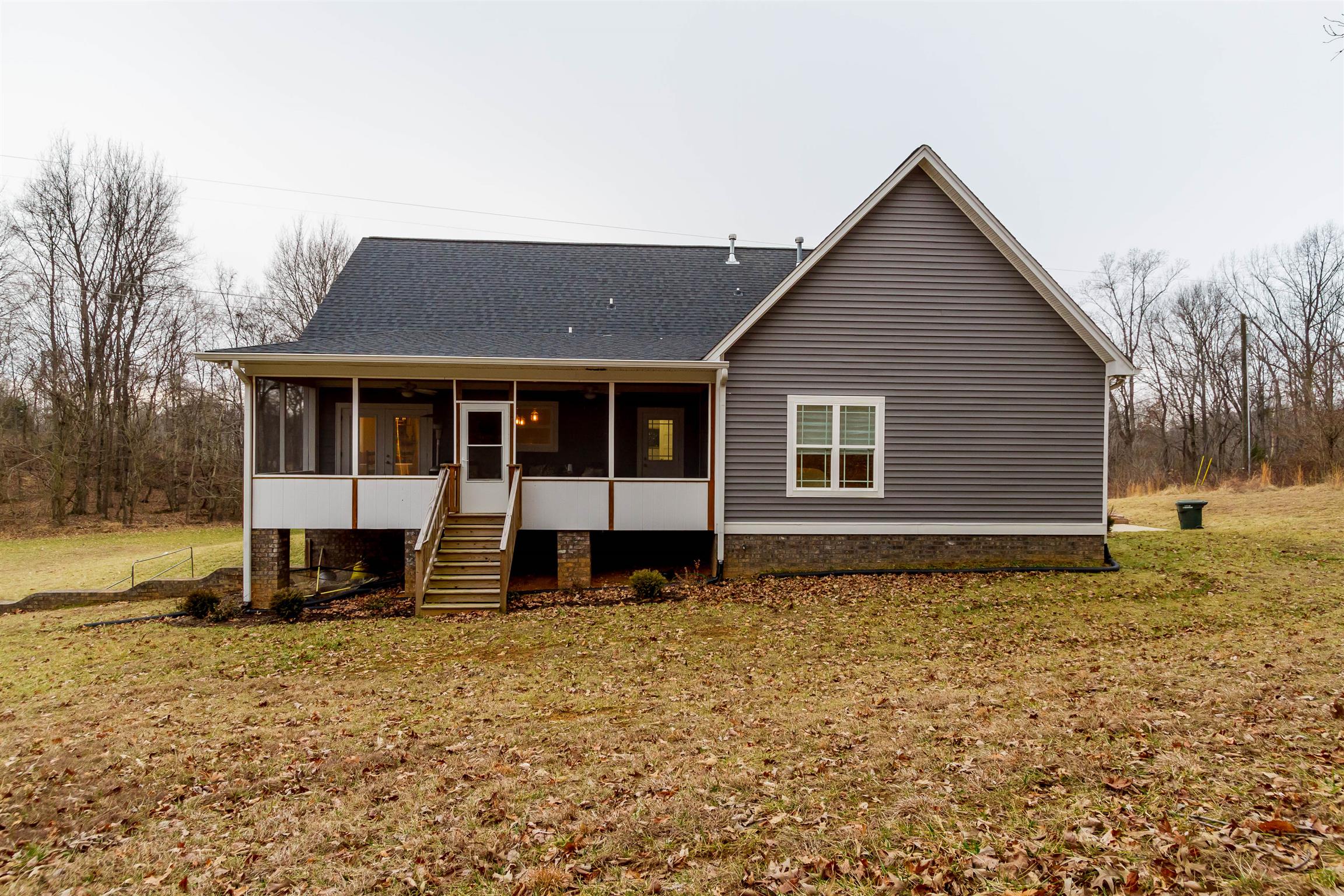 5488 Roy Pitt Road Springfield, TN 37172 - Photo 5 of 27 a house with trees in the background