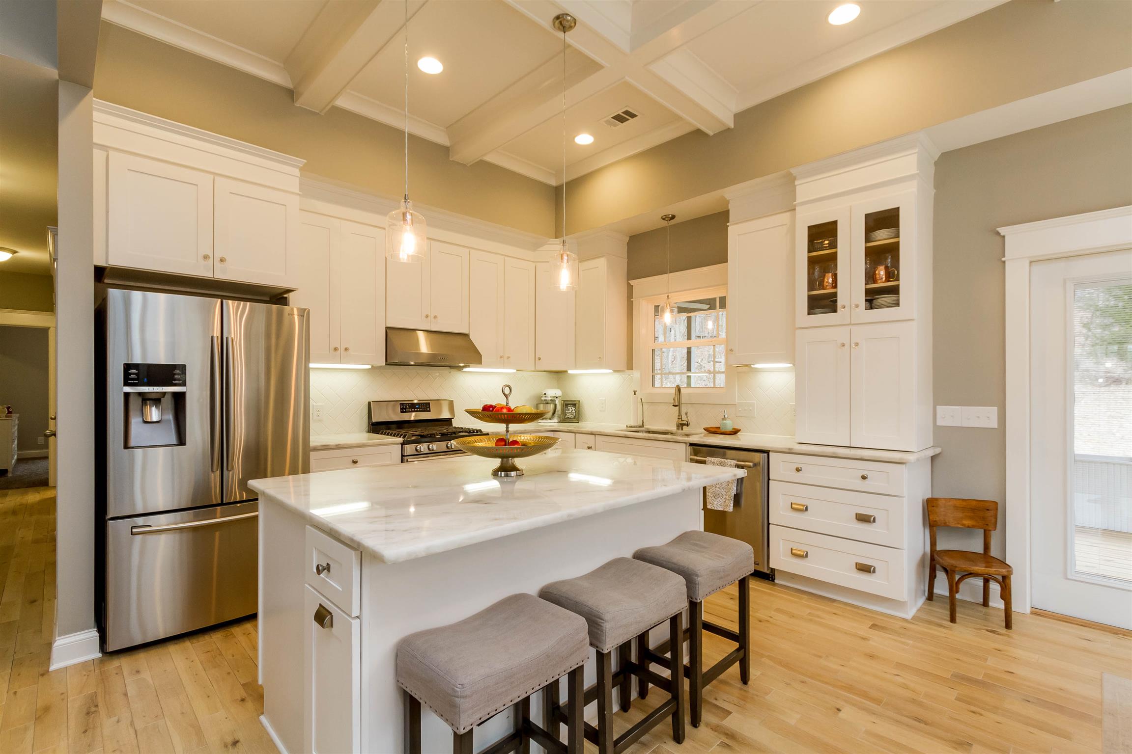 5488 Roy Pitt Road Springfield, TN 37172 - Photo 10 of 27 a kitchen with white cabinets and stainless steel appliances