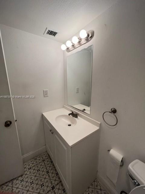 7001 Environ Boulevard, Unit 308 Lauderhill, FL 33319 - Photo 5 of 5 a bathroom with a sink a toilet a mirror and shower