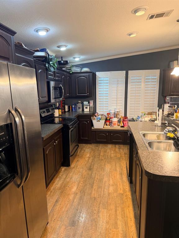 3520 East Gaskins Road, Unit LOT 5 Bartow, FL 33830 - Photo 12 of 16 a kitchen with stainless steel appliances granite countertop a sink a stove and a refrigerator