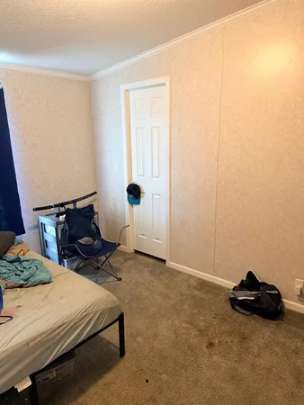 a bed room with a bed and a window