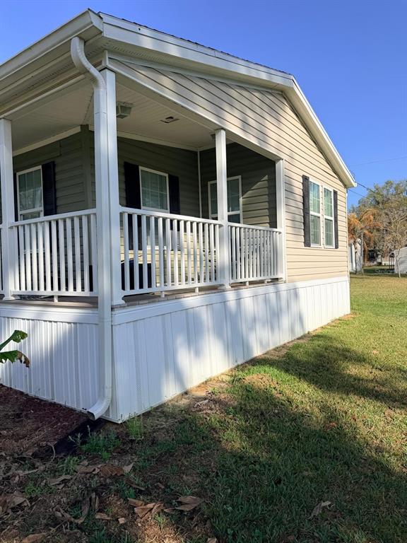 3520 East Gaskins Road, Unit LOT 5 Bartow, FL 33830 - Photo 3 of 16 a view of a house with backyard and sitting area