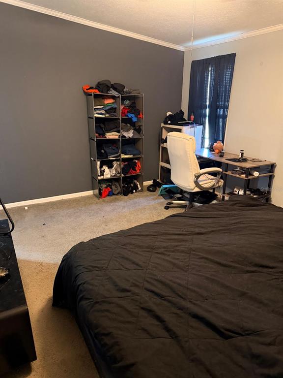 3520 East Gaskins Road, Unit LOT 5 Bartow, FL 33830 - Photo 5 of 16 a bed sitting in a room next to a window