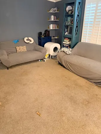 a bedroom with bed and a window