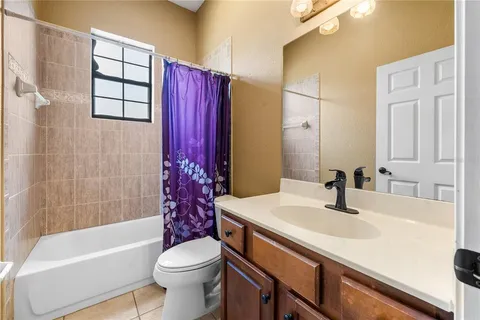 a bathroom with a sink a toilet and tub
