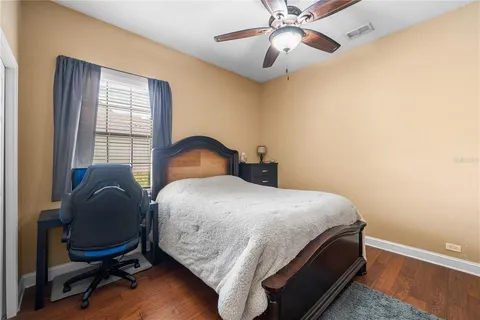 a bedroom with a bed and a chair
