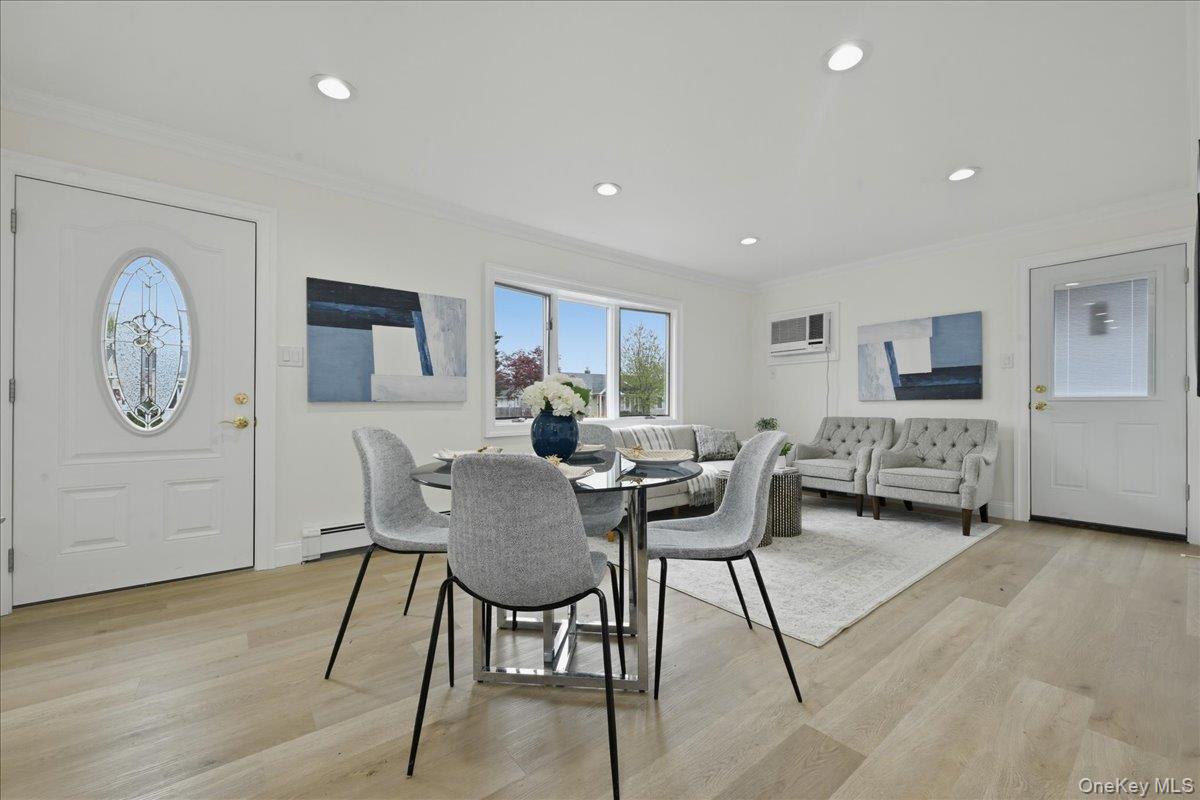 84 North Fordham Road Hicksville, NY 11801 - Photo 1 of 28 a view of a dining room with furniture window and wooden floor