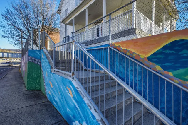 a view of balcony with wooden floor and stairs