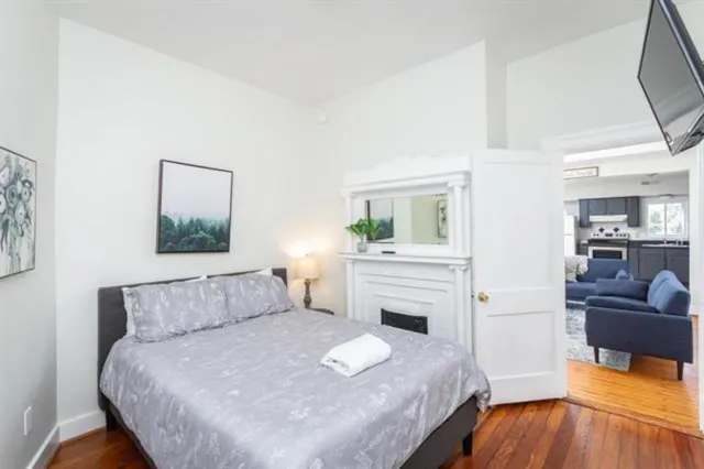 a kitchen with a refrigerator and a stove top oven
