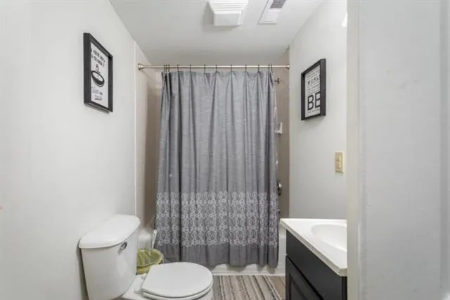 a kitchen with stainless steel appliances kitchen island granite countertop a refrigerator and microwave