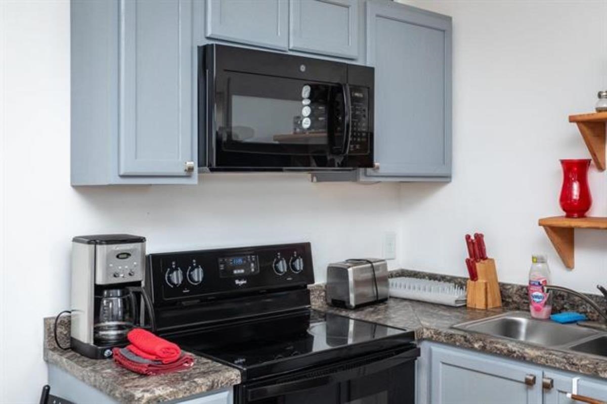 600 East Main Street Waynesboro, VA 22980 - Photo 23 of 33 a kitchen with a stove and a microwave