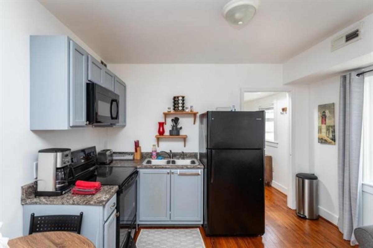 600 East Main Street Waynesboro, VA 22980 - Photo 24 of 33 a kitchen with a refrigerator and a stove top oven