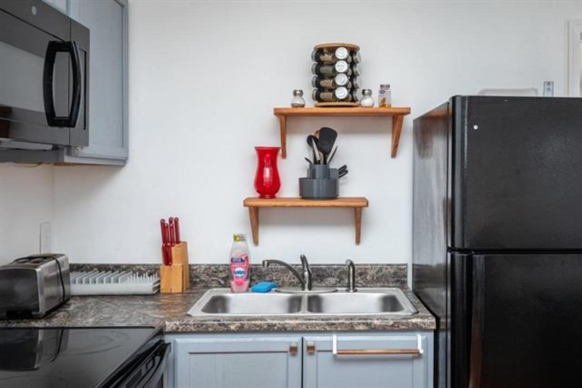 600 East Main Street Waynesboro, VA 22980 - Photo 25 of 33 a kitchen with stainless steel appliances granite countertop a sink stove and refrigerator