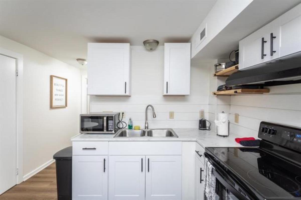 600 East Main Street Waynesboro, VA 22980 - Photo 8 of 33 a kitchen with stainless steel appliances granite countertop a sink stove and cabinets