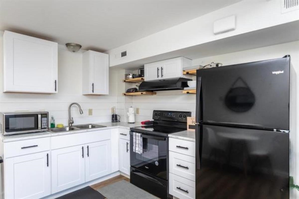 600 East Main Street Waynesboro, VA 22980 - Photo 9 of 33 a kitchen with a refrigerator and a sink