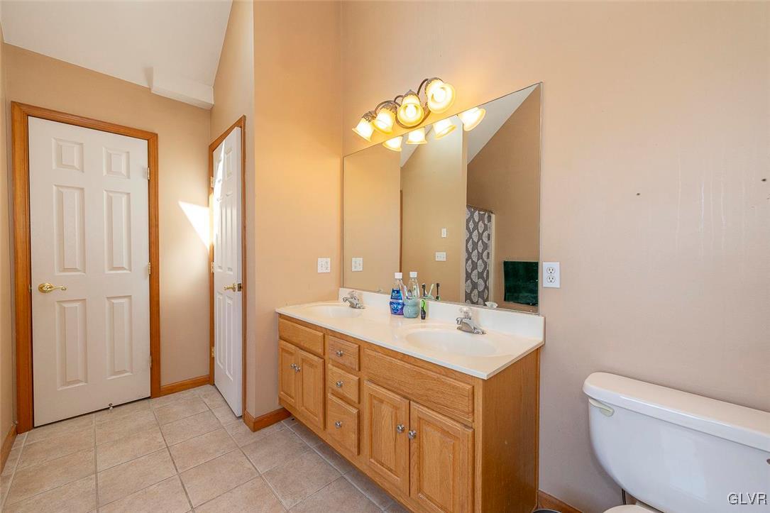 778 Bushkill Center Road Nazareth, PA 18064 - Photo 20 of 27 a bathroom with a double vanity sink mirror and toilet