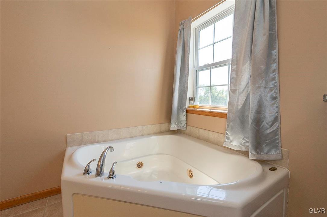 778 Bushkill Center Road Nazareth, PA 18064 - Photo 21 of 27 a bathroom with bathtub and window
