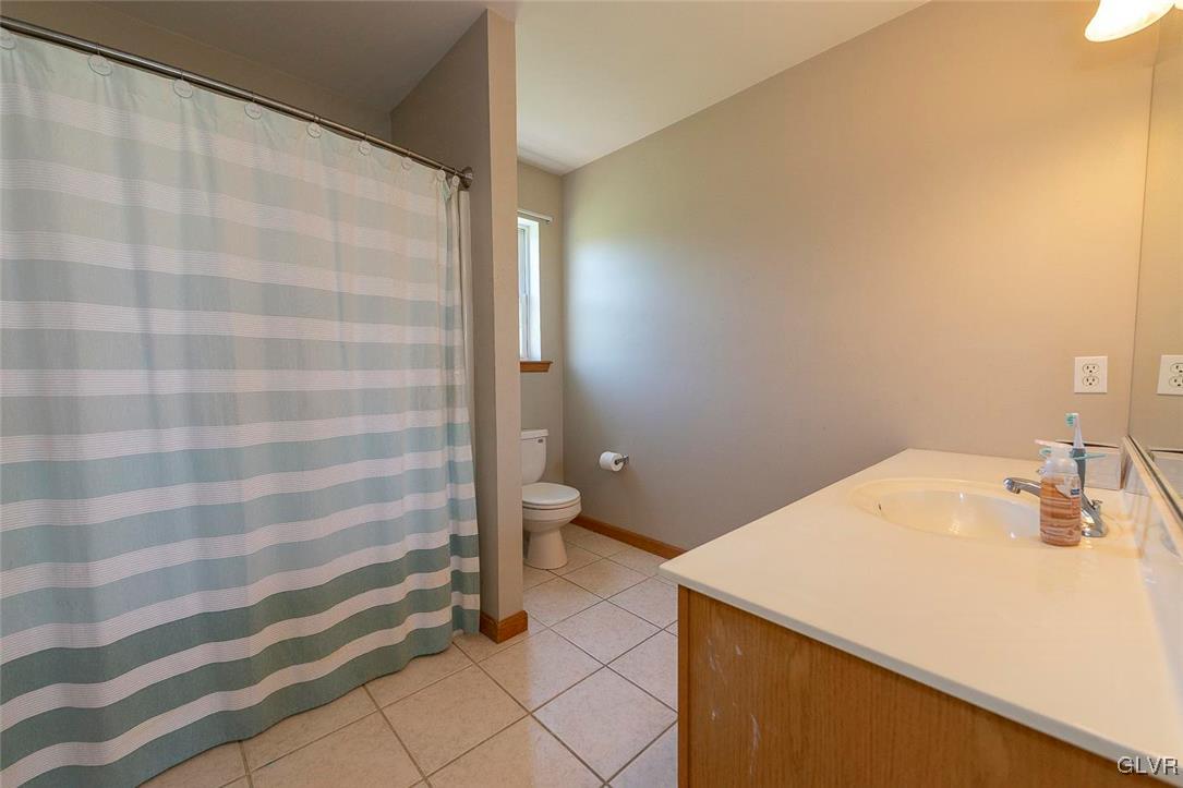 778 Bushkill Center Road Nazareth, PA 18064 - Photo 25 of 27 a bathroom with a sink a toilet and shower