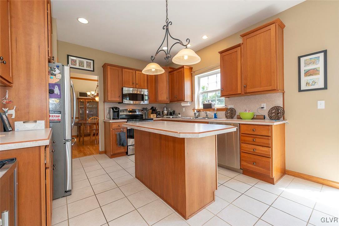 778 Bushkill Center Road Nazareth, PA 18064 - Photo 7 of 27 a kitchen with stainless steel appliances granite countertop a stove a sink and a refrigerator