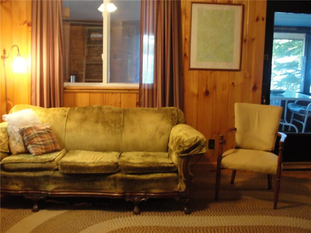 219 Win Brown Road Stoneham, ME 04231 - Photo 23 of 42 Living room has painted wood...