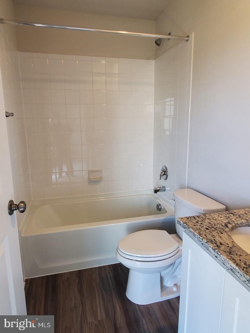 1992 Fauna Drive Frederick, MD 21702 - Photo 15 of 24 a bathroom with a granite countertop bathtub shower and toilet