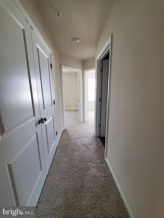 a view of an empty room and a window