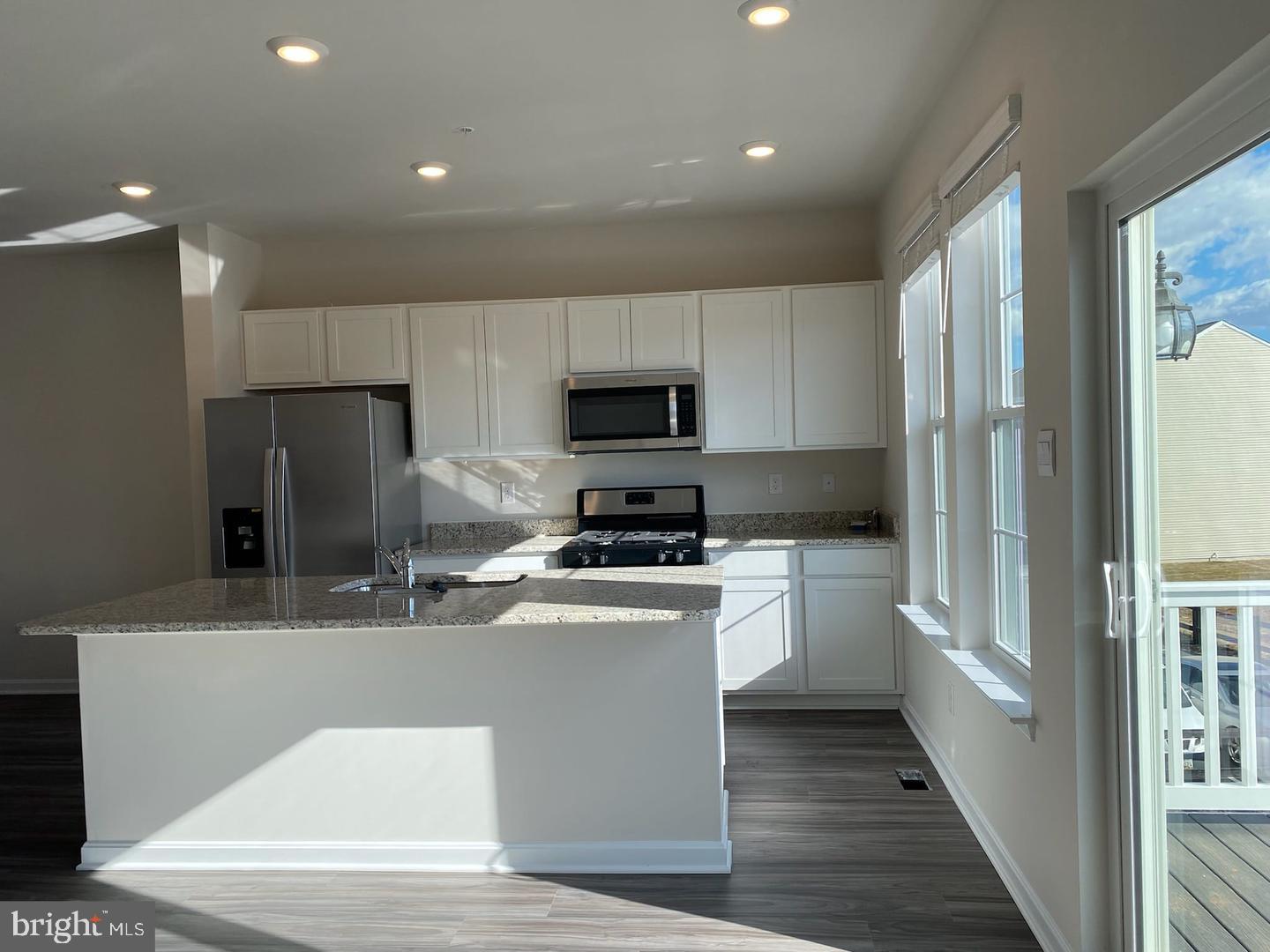 1992 Fauna Drive Frederick, MD 21702 - Photo 7 of 24 a kitchen with stainless steel appliances granite countertop a refrigerator a stove a sink and a microwave