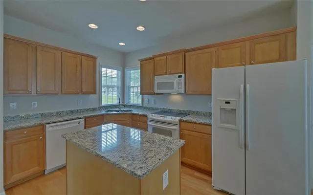 a kitchen with a sink and a refrigerator