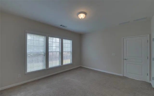 a view of a room with an empty space and a sink